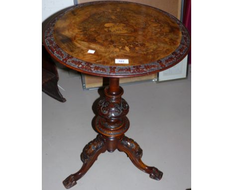 A Victorian walnut tripod table, carved and inlaid, 20"