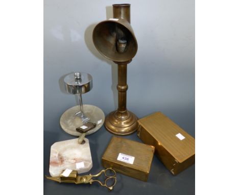 A 19th century candle lantern, spring loaded; a 1920's cigarette lighter; a "British Pullmatch" stand; other smoking related 