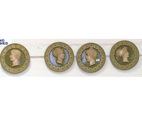 An early 20th century set of 4 painted plaster roundels, each with classical portrait bust portrait to the centre, 12½"