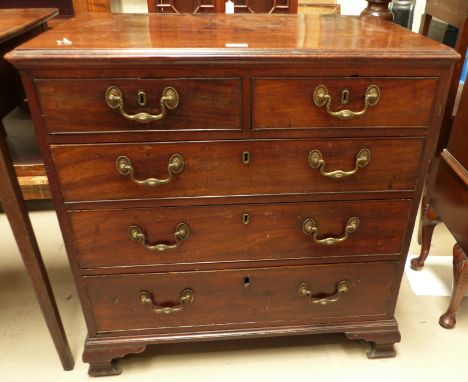 A mid Georgian mahogany chest of drawers of small proportions, fitted 2 short and 3 long drawers with cast brass swan neck ha