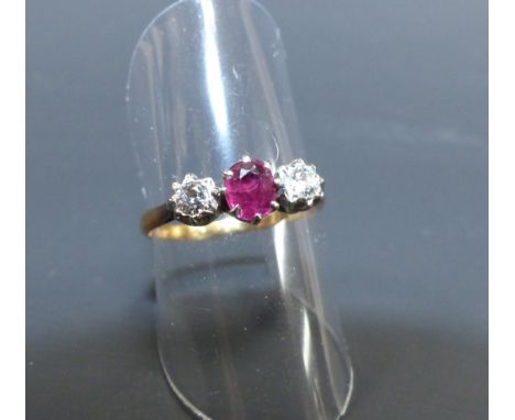 A ladies 18 carat gold dress ring set ruby and 2 diamonds, 2.5 gm