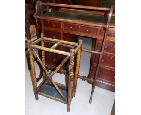 A bamboo stick stand; a mahogany towel rail