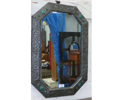 An Arts & Crafts beaten pewter mirror with applied glazed ceramic jewels, 26" 