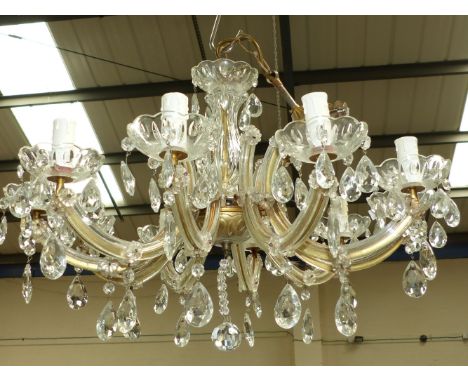 A 10 branch glass chandelier with drops and candlesticks