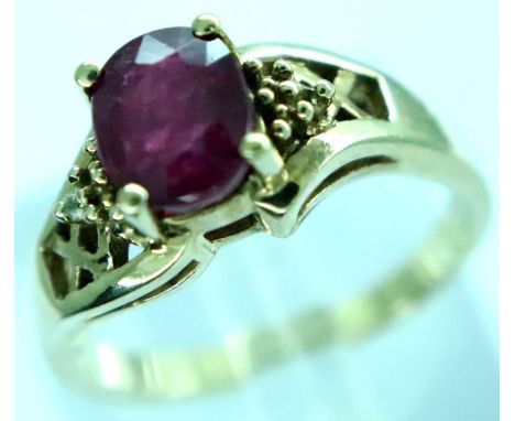 9ct gold ruby ring set with diamond shoulders, size N/O, 3.5g. P&amp;P Group 1 (£14+VAT for the first lot and £1+VAT for subs