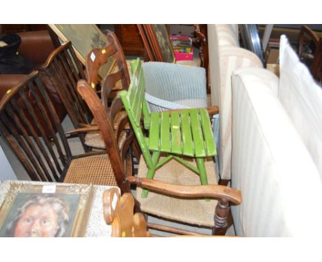An oak ladder back and string seated elbow chair 