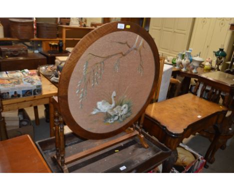 A mahogany and embroidered firescreen / folding table decorated with swans