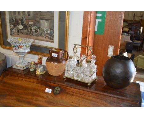 A silver plated six bottled cruet stand; together with a Doulton Lambeth harvest ware jug; a Dresden porcelain pedestal bowl;