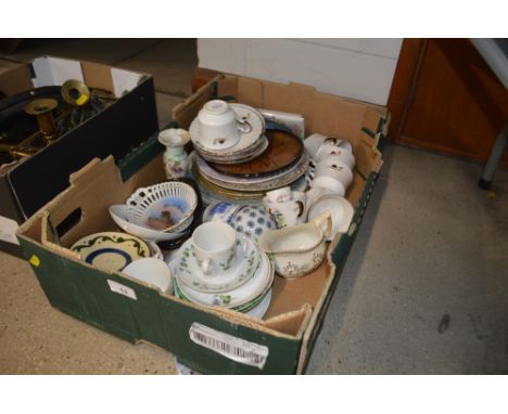 A box of various decorative plates, cups etc. 