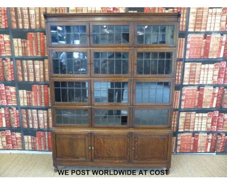 An oak Globe Wernicke style five section bookcase, each tier with a pair of double doors and one single door (width 134cm, de