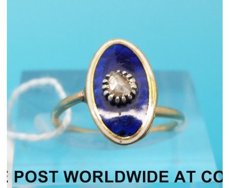 A Victorian ring set with blue guilloche enamel and a point cut diamond 
