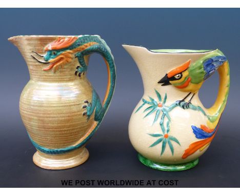 Two Art Deco pottery jugs including a Burleigh Ware example with dragon handle, the other marked 'Tropical' to base, tallest 