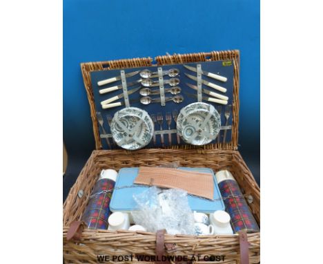 A vintage picnic hamper with original contents, width 62cm