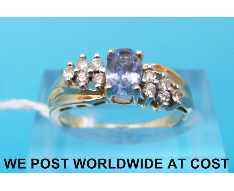 A yellow metal ring marked 14k set with topaz (size K)