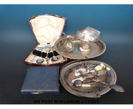 A quantity of silver plated ware to include swing handled baskets, cased cutlery etc and various small enamel items, charms e
