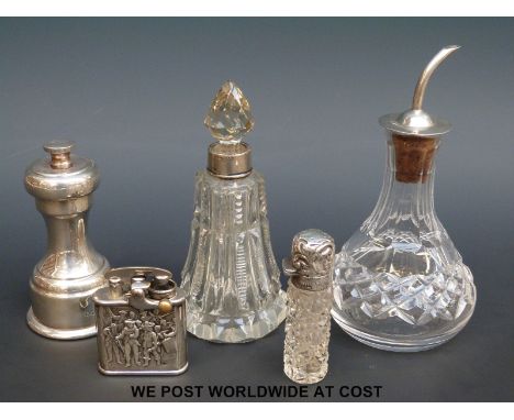 A hallmarked mounted Mappin & Webb pepper grinder, Colibri lighter and three hallmarked silver mounted items