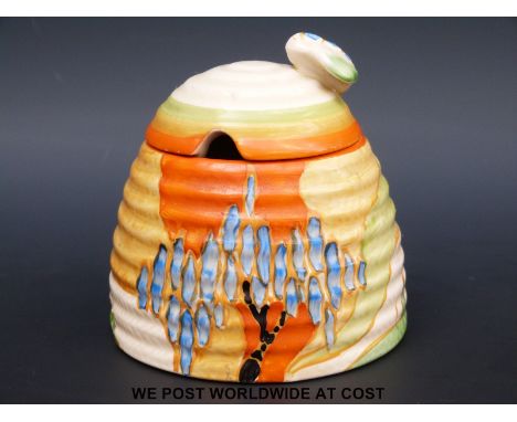 A Clarice Cliff honey pot with bee finial (9cm tall)