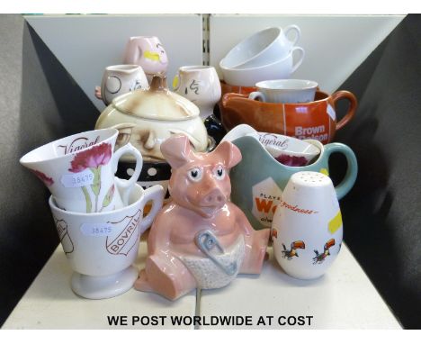A collection of promotional memorabilia for Martell cognac, Guinness, Player's Weights cigarettes, a Nat West pig, Brown and 