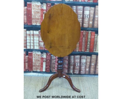 A 19thC mahogany shaped tilt top table or a tripod base