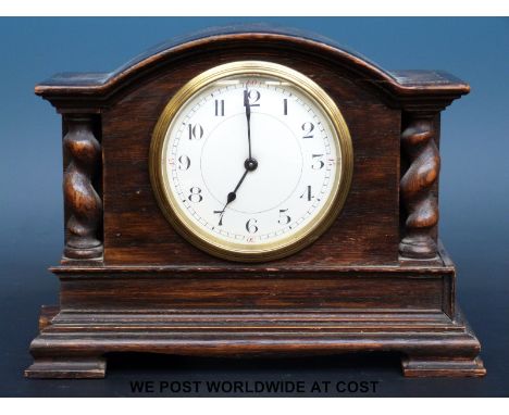 A Buren oak cased mantel clock with barley twist decoration, 15cm tall