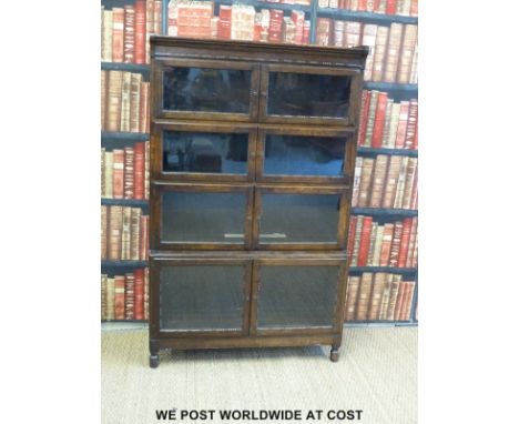 An oak Globe Wernicke style four section bookcase with double opening doors to each section (width 89cm, depth 29cm, height 1