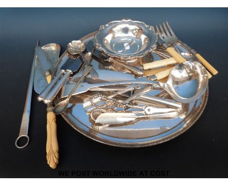 A 19thC silver plated tray (diameter 36.5cm) and a quantity of plated cutlery including ladle, meat skewer etc 