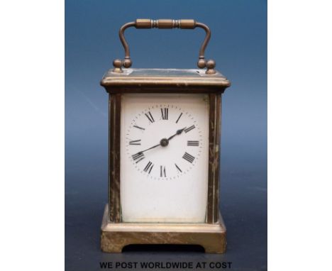 A French brass carriage clock with enamelled dial and blued spade hands
