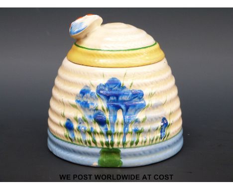 A Clarice Cliff Blue Crocus pattern honey pot with bee finial (9cm tall)