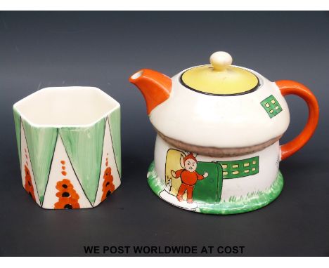 A small Mabel Lucie Attwell  teapot in the shape of a pixie's house together with a piece of Ivory Ware by Handcocks (tallest