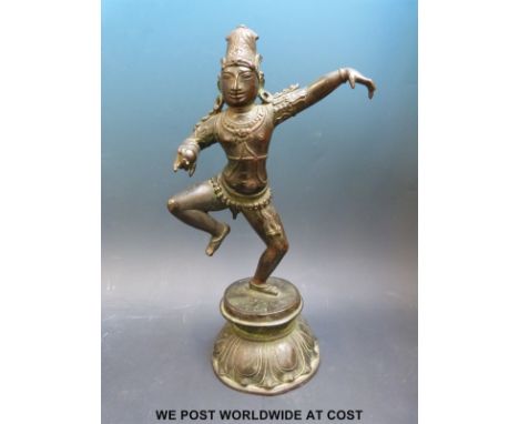 A bronze or similar model of an Indian god, 26cm tall