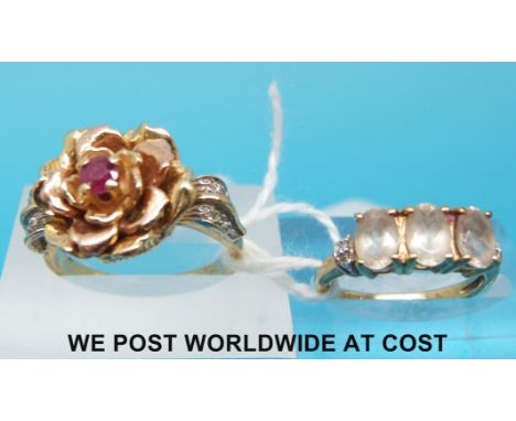 A yellow metal ring marked 585 set with a ruby and a 9ct ring set with quartz