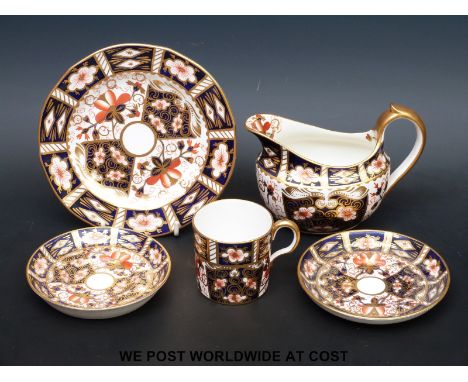 A Royal Crown Derby 2451 pattern coffee can, two saucers, cream jug and plate