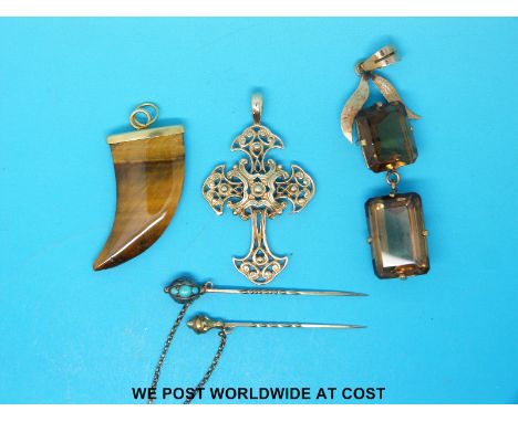 A yellow metal stick pin set with turquoise, a yellow metal pendant set with two smoky quartz, a 9ct gold cross pendant and a