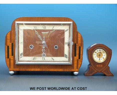 An oak cased mantle clock with Art Deco style decoration. 