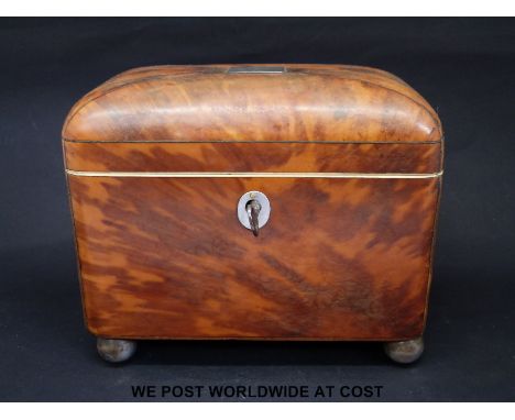 A Georgian blonde tortoiseshell two division tea caddy raised on ball feet, width 15cm, depth 9cm, height 12.5cm