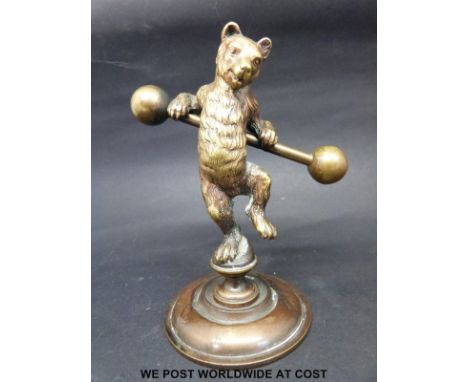 A 19thC bronze performing bear with ball ended pole, on circular base (height 12cm)