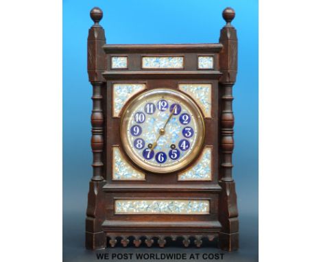 A two train shelf clock in mahogany pillared case, inset with painted metal panels decorated with cherry blossom, the dial wi