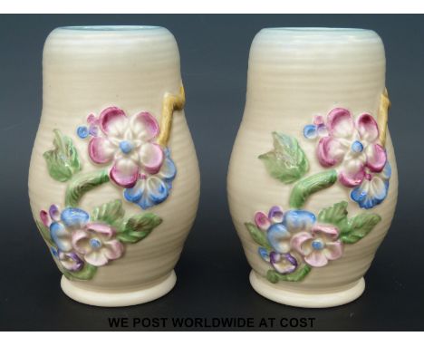A pair of Clarice Cliff relief moulded vases with floral decoration (15cm tall)