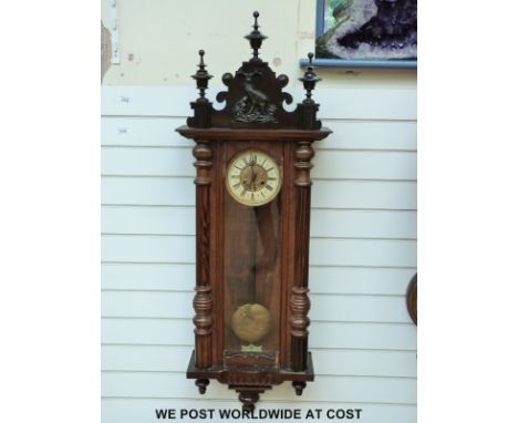 A German Vienna regulator style wall clock with carved deer decoration to top