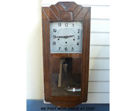 A c1910 oak cased three train wall clock together with a Bakelite Enfield two train mantel clock