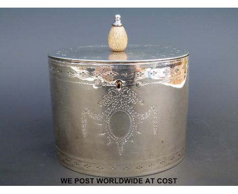 A Georgian hallmarked silver oval tea caddy with bright cut decoration and hinged lid, London 1782, maker William Plummer (he