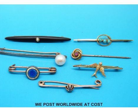 A yellow metal stick pin, marked 9k, set with a ruby in the form of a knot, yellow metal brooch, marked 15, set with turquois