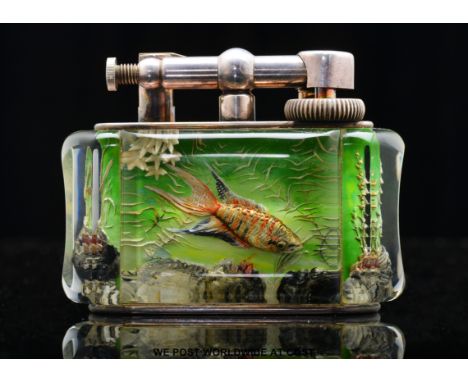 Dunhill Aquarium half giant size table lighter, the lucite panels intaglio decorated with two fish to one side and one fish t