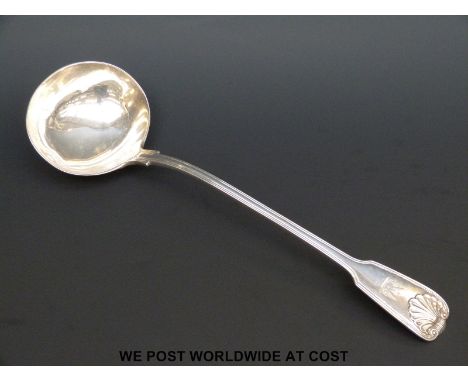 A Victorian hallmarked silver fiddle thread and shell pattern ladle, length 34cm, London 1855 maker George W Adams (292g)