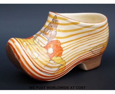 A Clarice Cliff clog decorated with a variation of Fir Trees pattern, with Clarice Cliff, Bizarre and Wilkinson pottery stamp