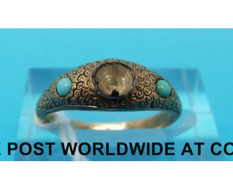 A yellow metal ring set with turquoise (size K/L)