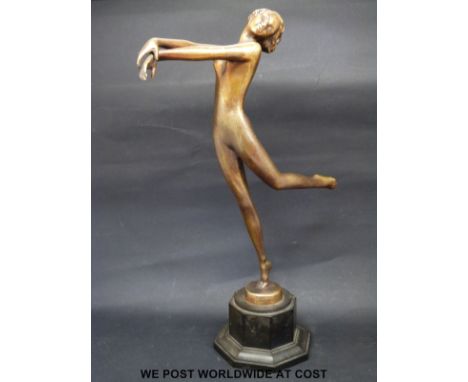 A Lorenzl patinated bronze Art Deco dancing girl, signed to base of figure, on octagonal base (26 cm tall)