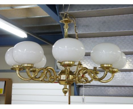 An eight branch brass chandelier light fitting (diameter approximately 74cm)