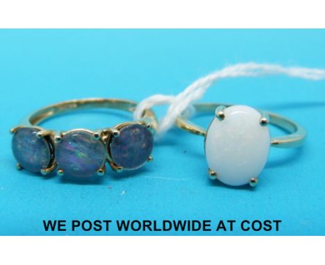 A 9ct gold ring set with three opal doublets and a 9ct gold ring set with an opal