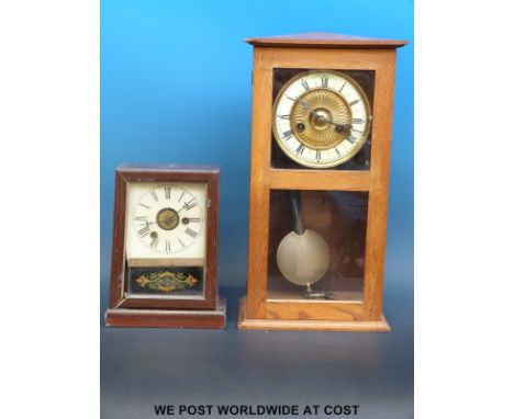 A striking shelf clock in light oak case, 42cm tall, with ivory coloured chapter ring, together with a German Postman's Alarm